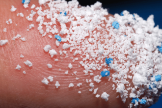 Close-up of sugar and salt crystals contaminated with microplastic particles